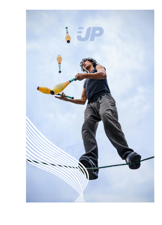 Ein Drahtseiltänzer jongliert in luftiger Höhe